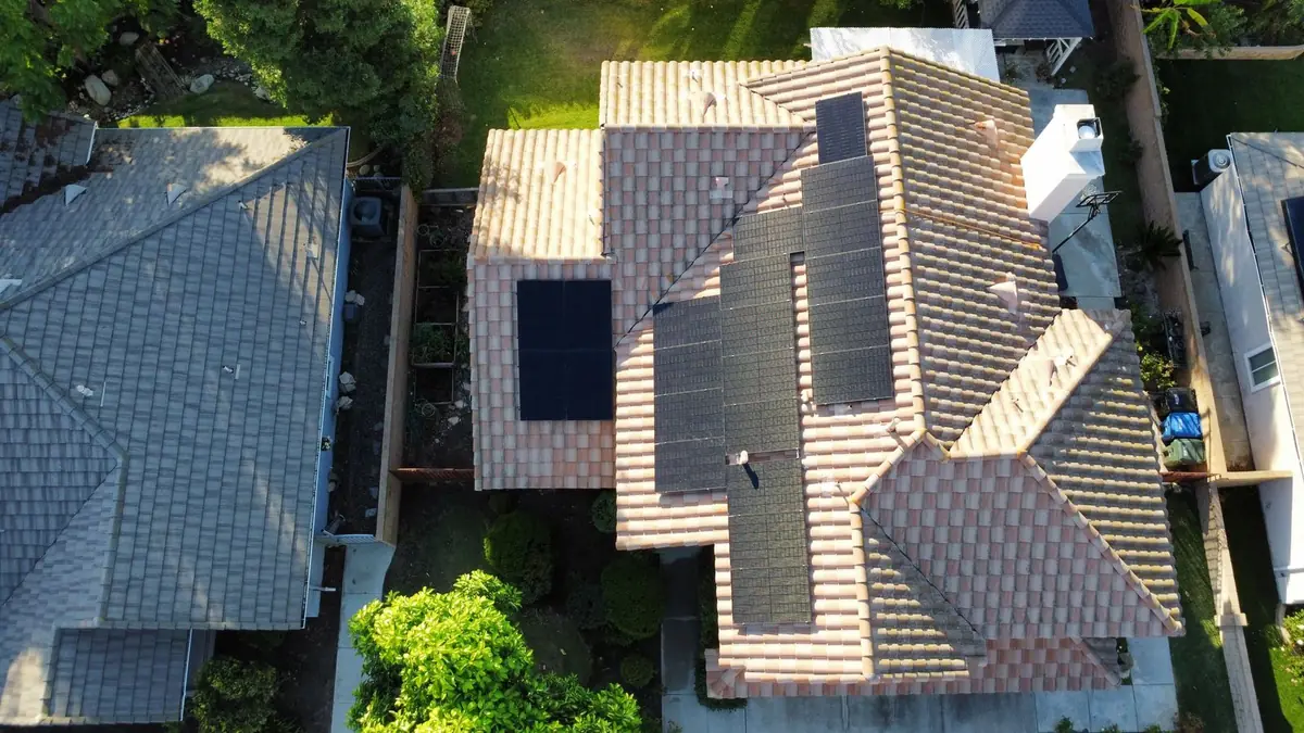 Aerial view of solar panels on a tile roof
