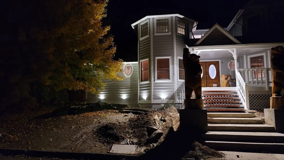 House at night with new exterior wall and porch lighting
